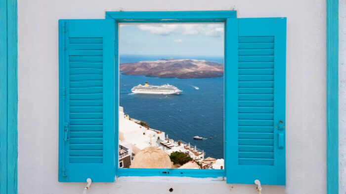 Caldera view in Santorini with whitewashed buildings and the Aegean Sea, perfect for cruise visitors