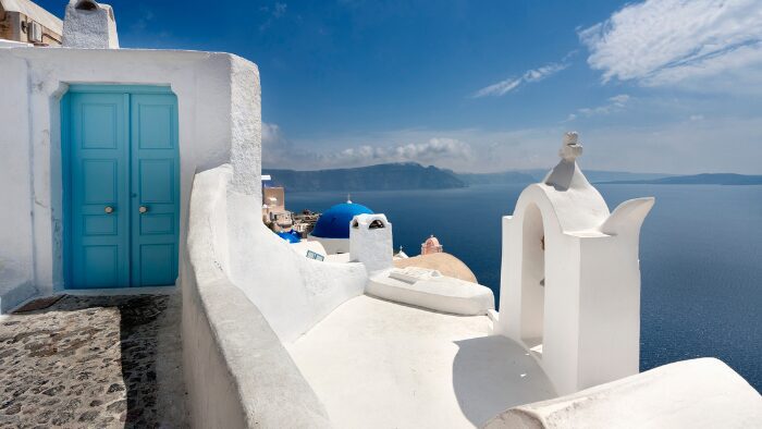 Caldera view in Santorini with whitewashed buildings and the Aegean Sea, perfect for cruise visitors