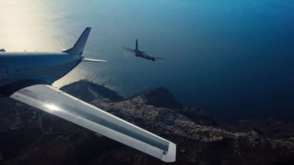 Passenger plane on final approach to Santorini Airport JTR over the Aegean sea